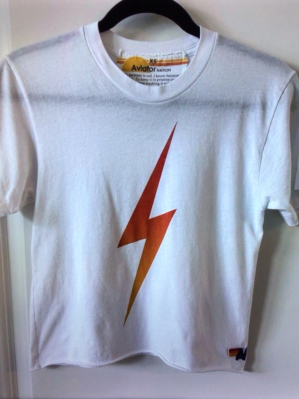 Aviator Nation White Tee with Orange-to-Gold Lightning Bolt